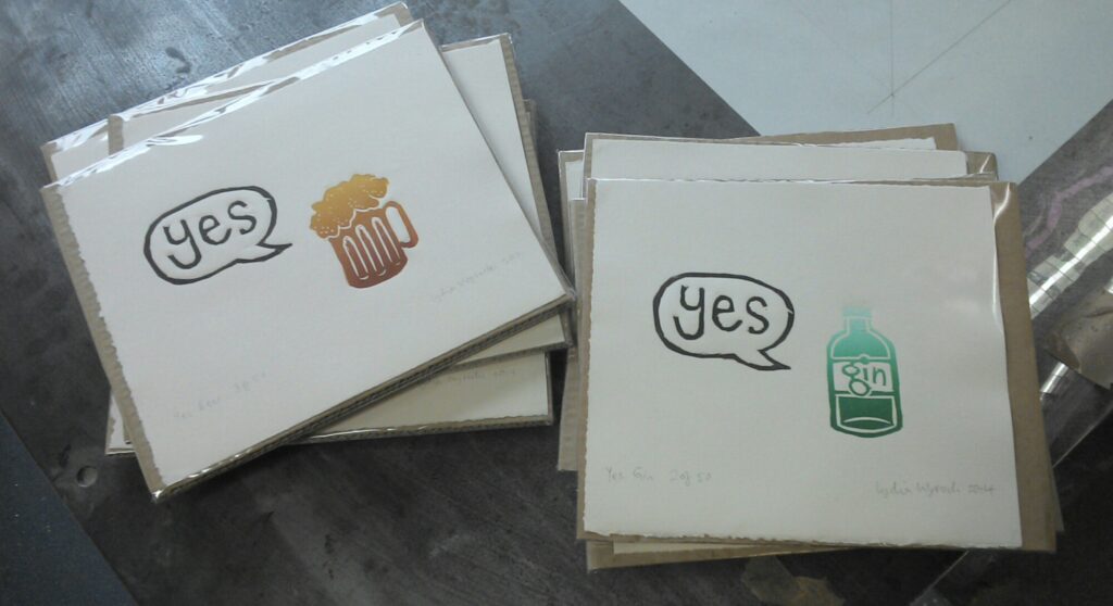 photo of Yes Beer (beer stein & yes speech bubble) and Yes Gin (gin bottle & yes speech bubble) linocuts